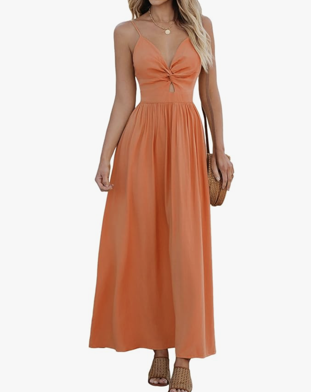 A woman wearing an orange sleeveless V-neck maxi dress with a small waist cutout, styled as a vibrant and elegant dinner outfit for a cruise.
