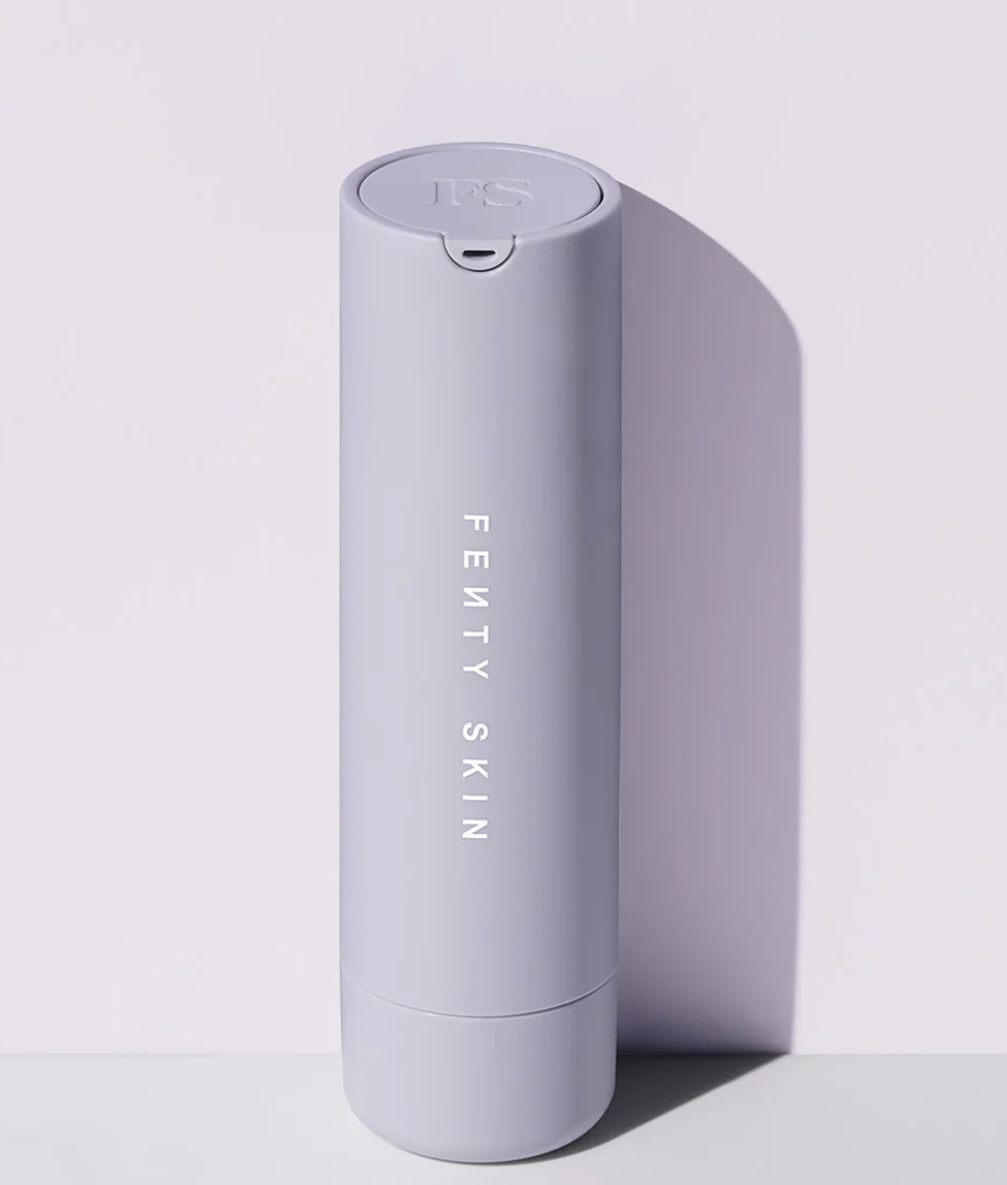 Product shot of the Fenty Skin Hydra Vizor Invisible Moisturizer Broad Spectrum SPF 30 in a lavender-colored refillable bottle, featured as a top hydrating sunscreen for all skin tones.