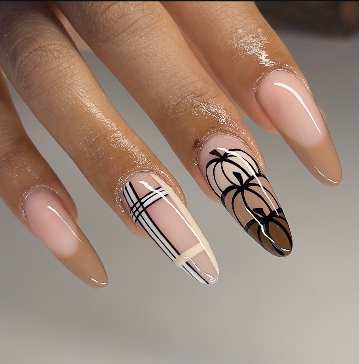 Pumpkin and plaid nail art in rust, cream and chocolate-brown tones