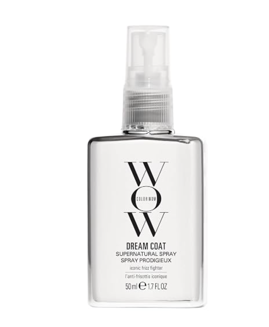 Clear spray bottle of Color Wow Dream Coat Supernatural Spray anti-frizz treatment.