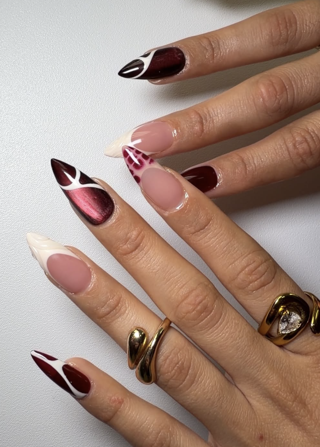 Deep burgundy velvet cat-eye manicure for Thanksgiving