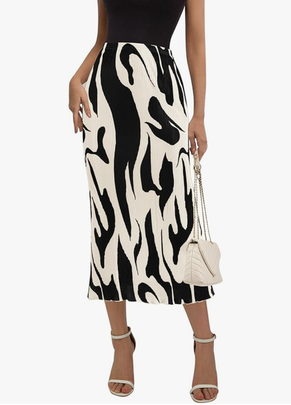 A woman wearing a black and white abstract print Line Pleated Long Skirt with a high-waisted fit, styled for a summer BBQ outfit.