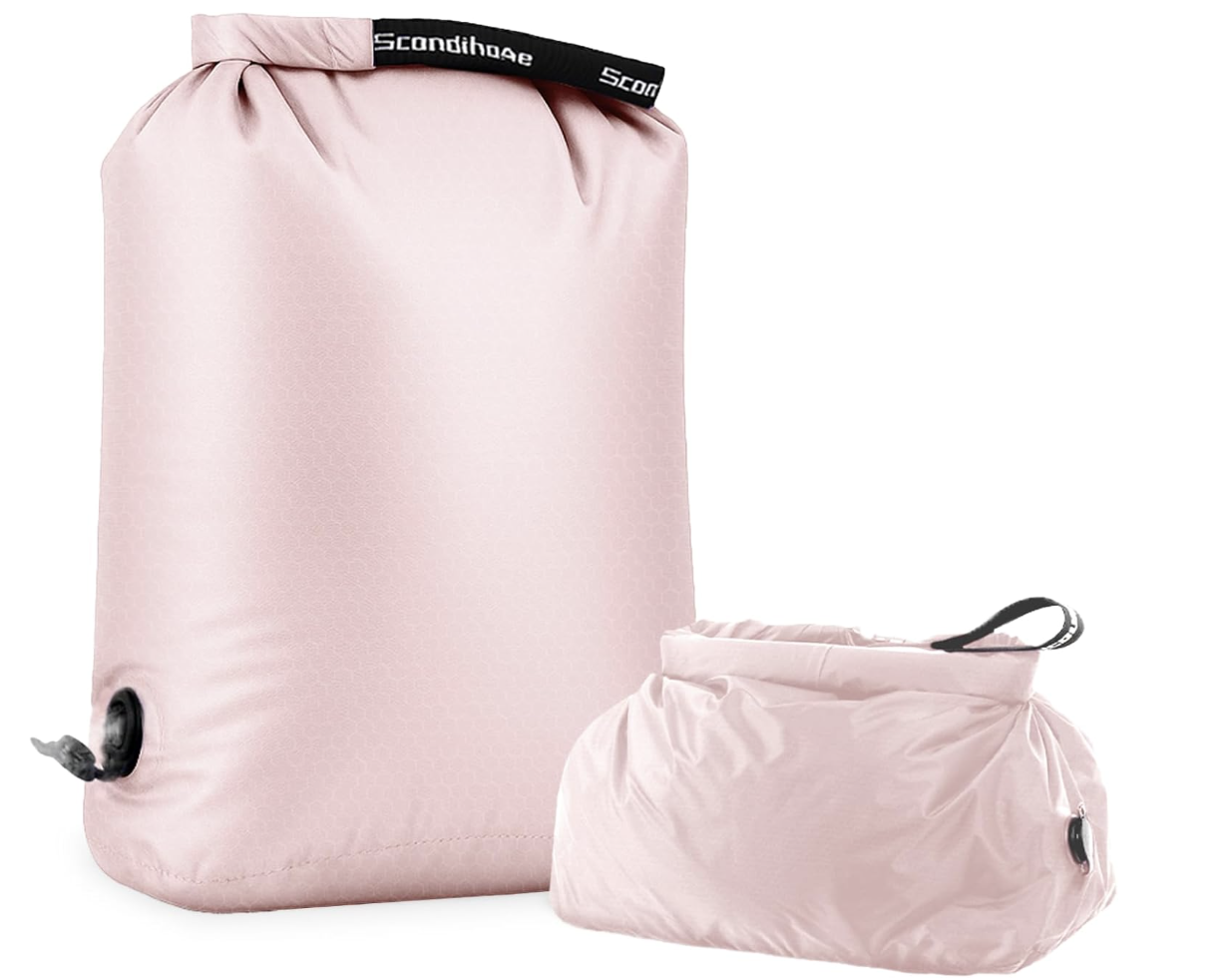 Foldable travel laundry bag beside an open suitcase
