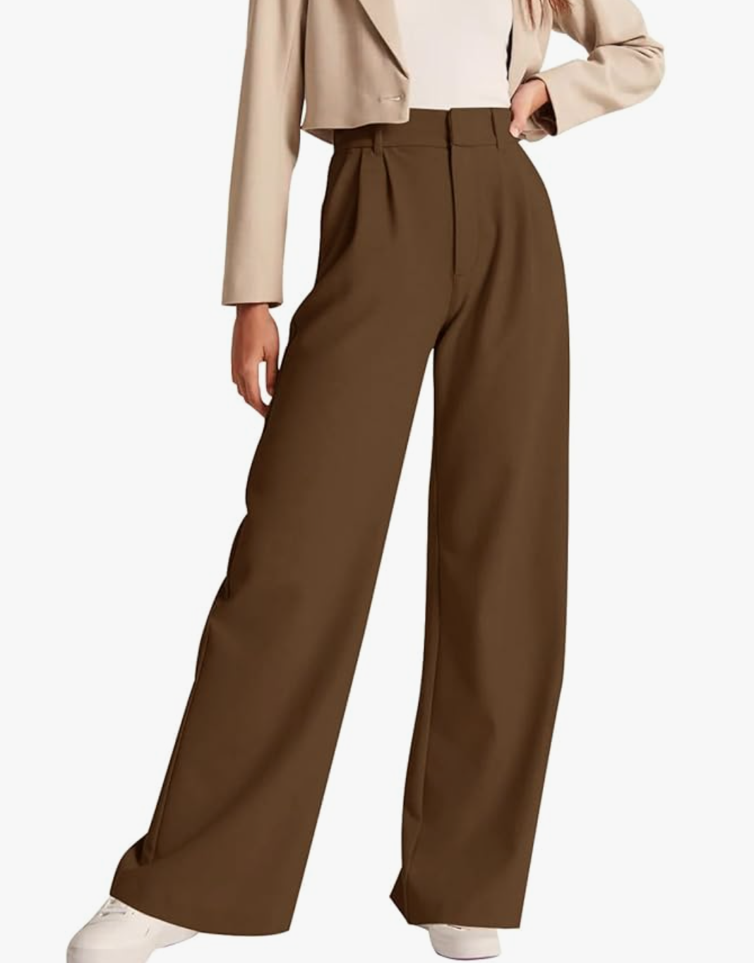 A pair of dark brown high-waisted work pants styled with a neutral top to show a professional business casual outfit.