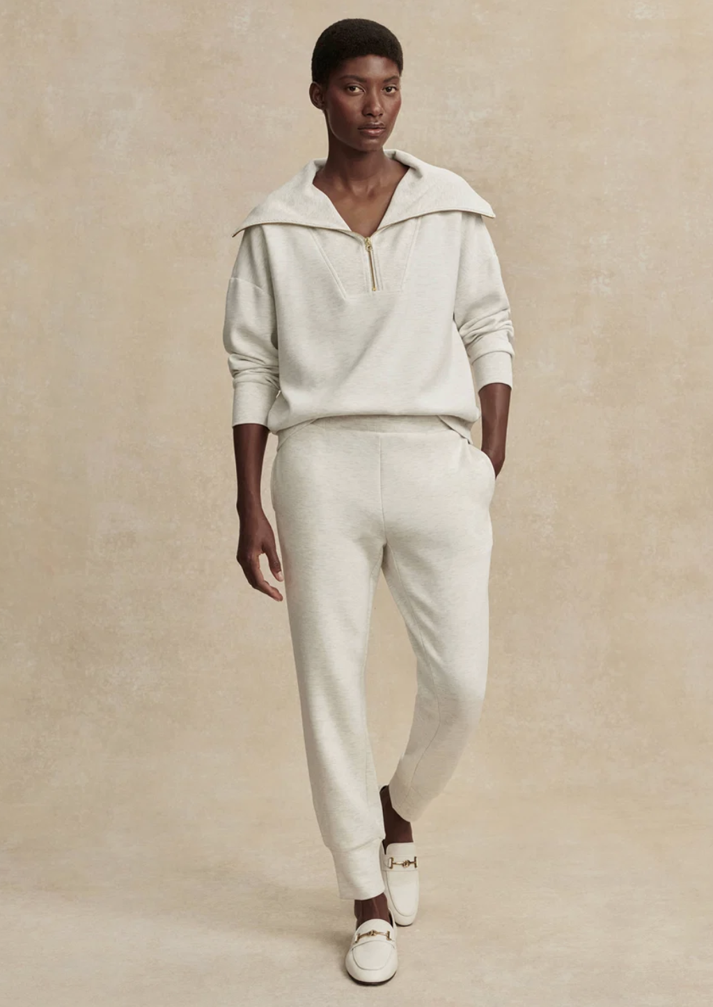 Black Vuori Performance Jogger styled with white sneakers