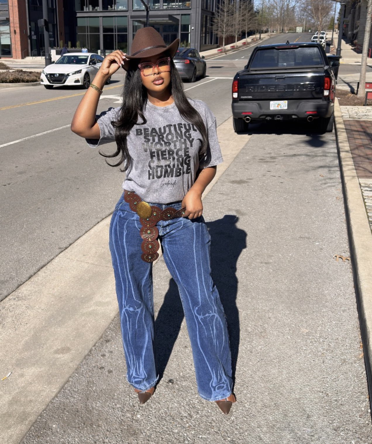 Full-length country concert outfit with jeans graphic tee