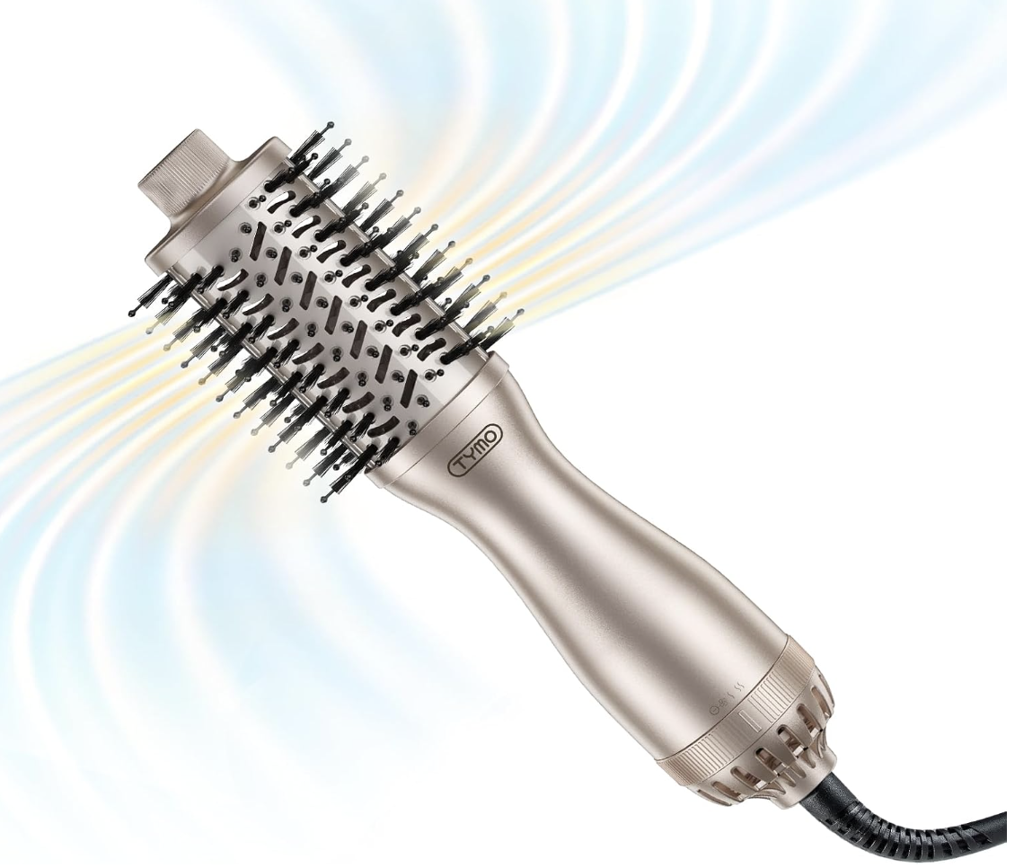 A metallic champagne gold TYMO hot air volumizer brush showing air airflow vents and bristled oval barrel on a clean background.