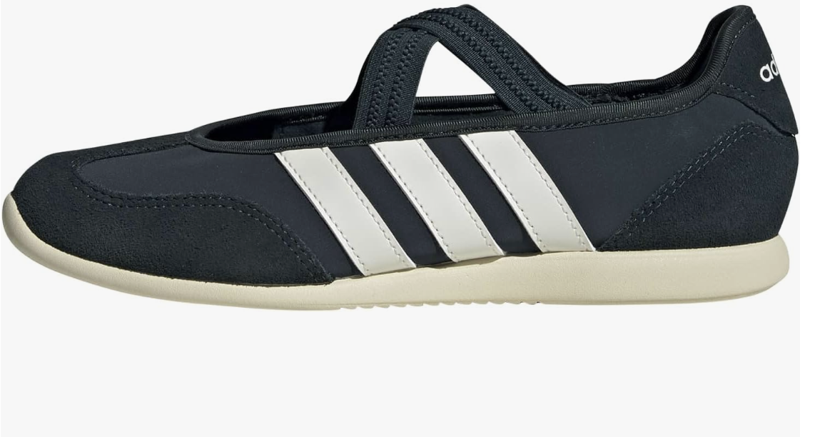 A side profile of the adidas Women's Barreda Mary Jane sneaker in navy blue suede with three white stripes and a black elastic strap, shown against a transparent background.