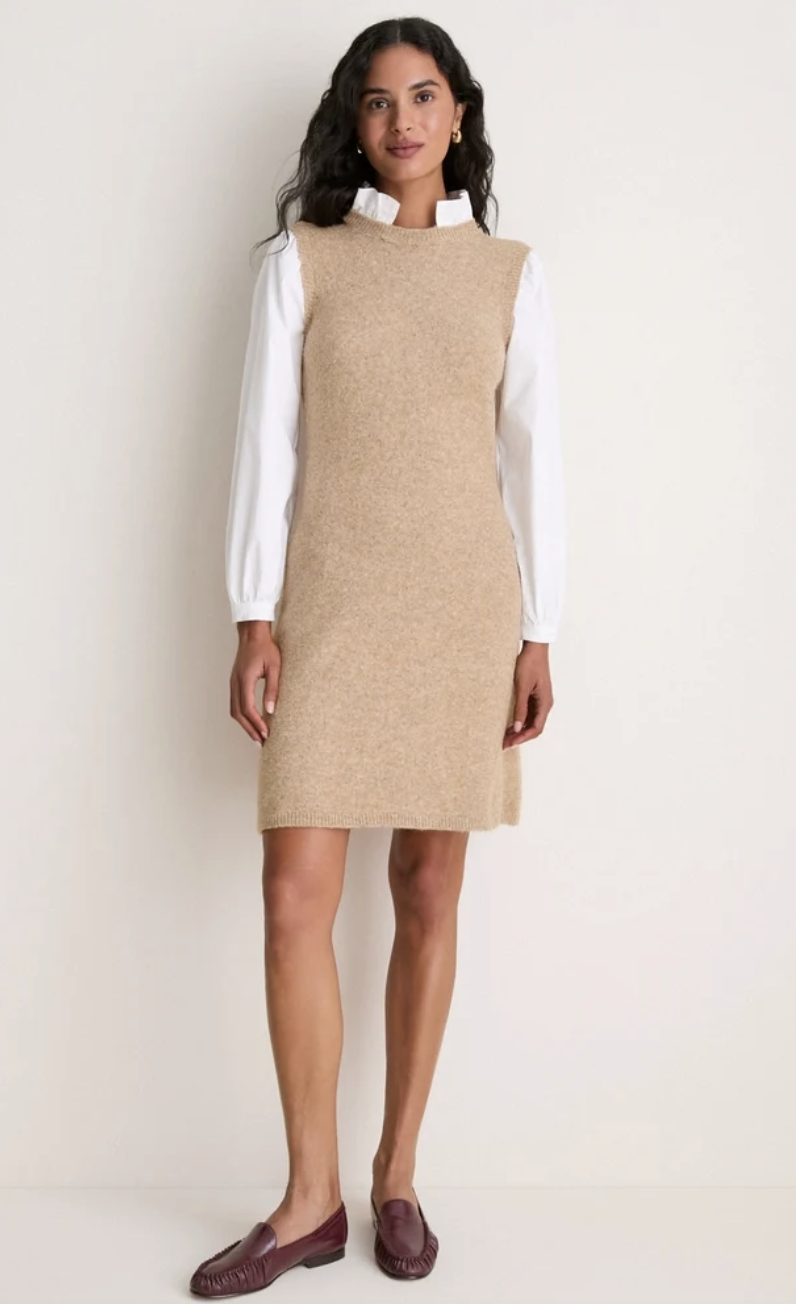 Model wearing a beige sleeveless knit column midi dress paired with burgundy leather loafers on a white background.