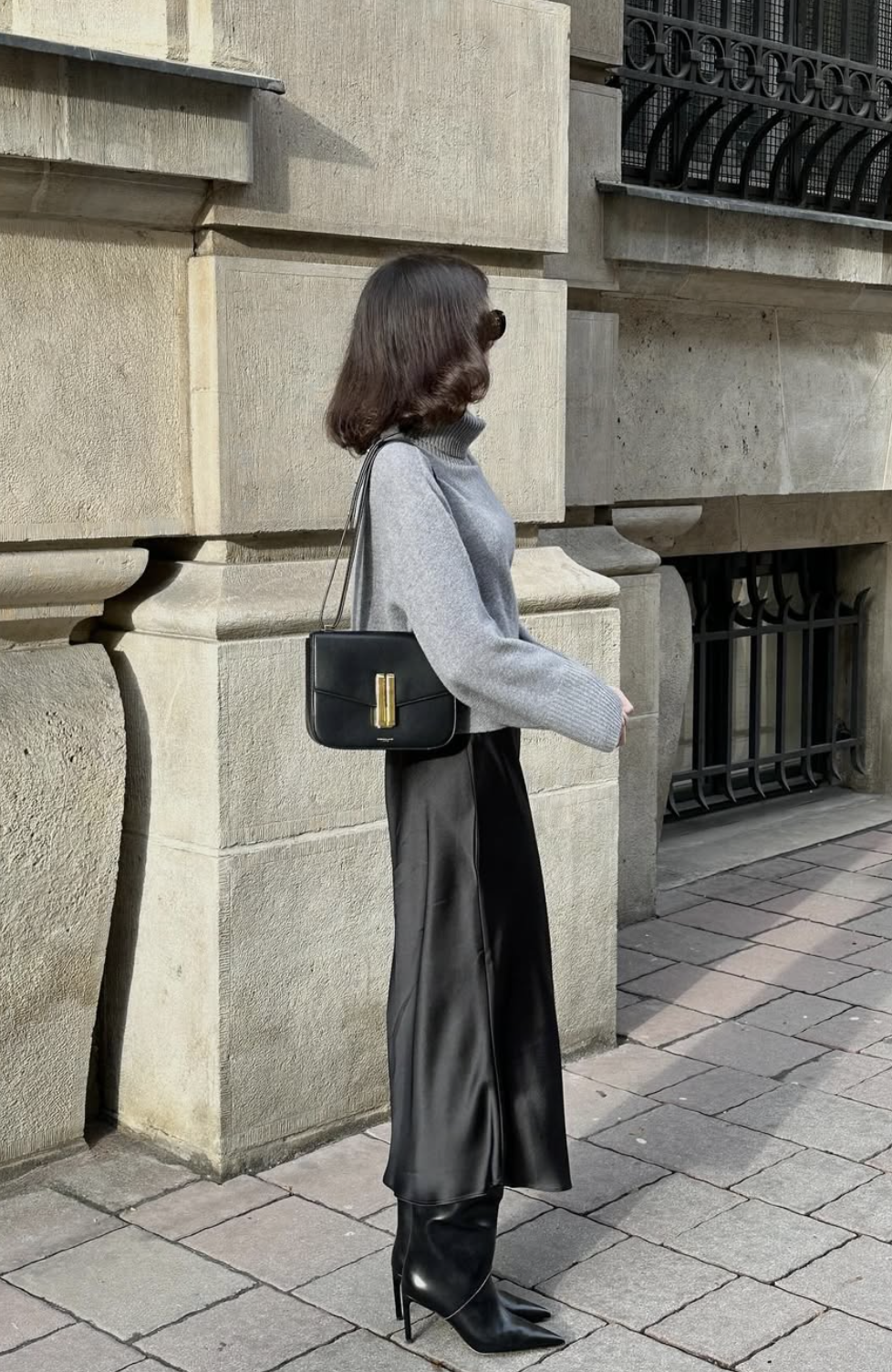 Full-length midi skirt black boots work outfit showing the complete boot shaft and shoes