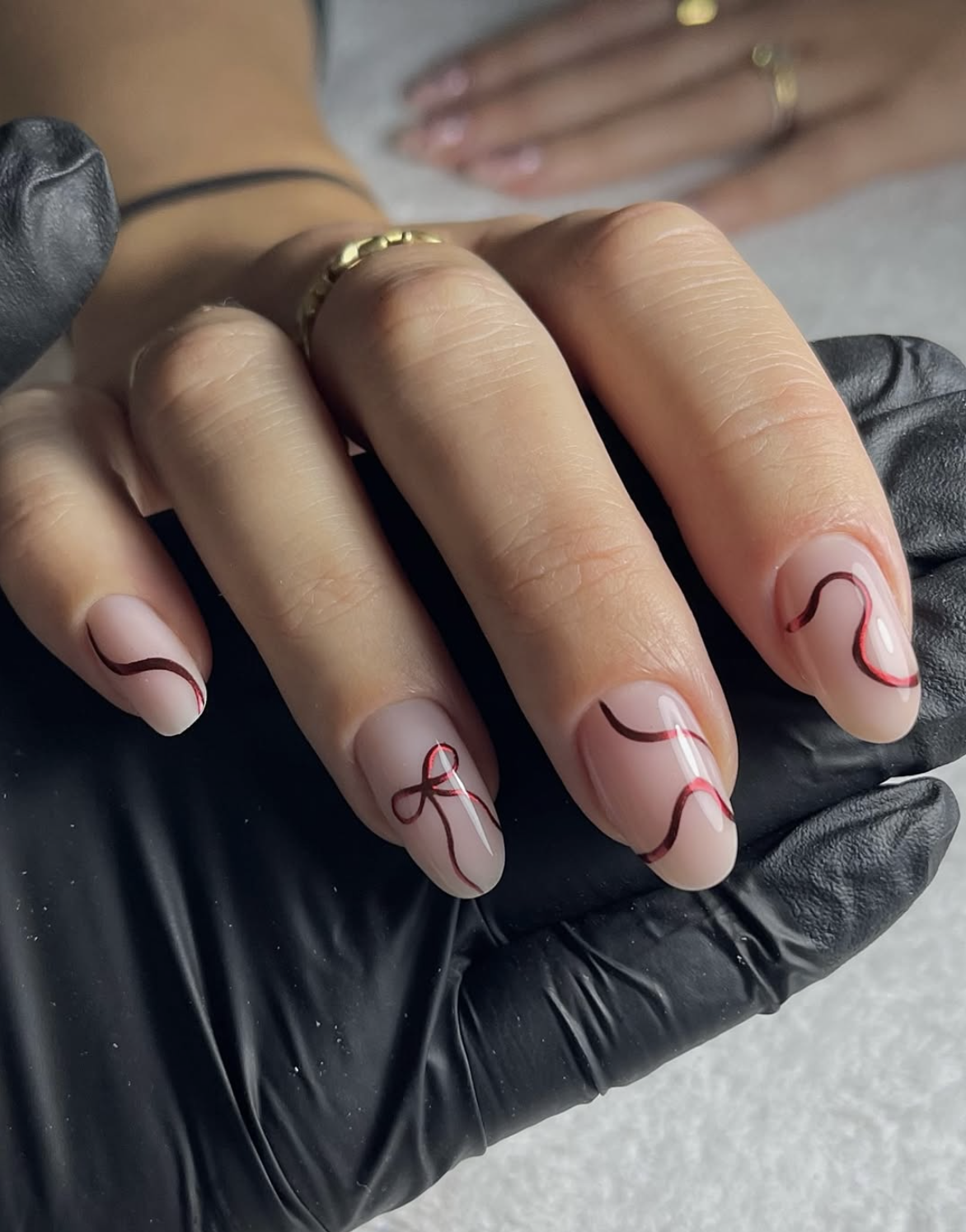 Red floral line art nail design