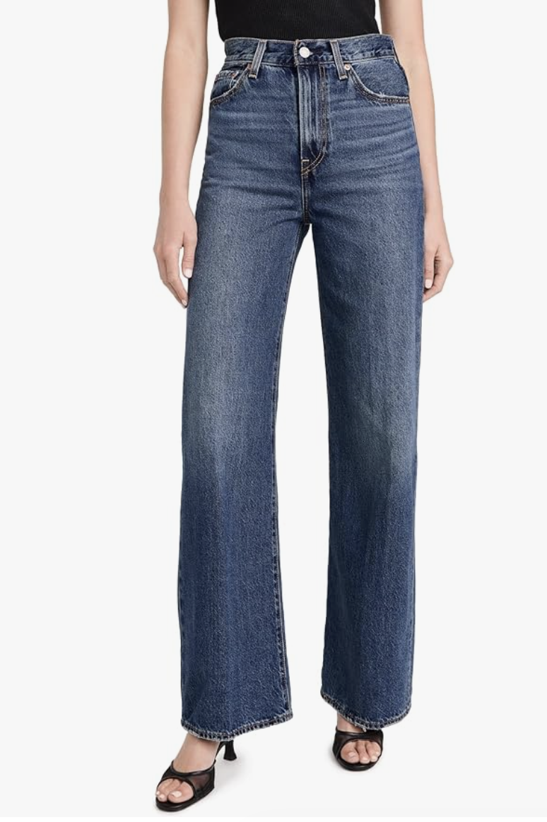 : A close-up of Levi's Ribcage Wide Leg jeans with a 12-inch extra high rise, specifically styled to balance a long torso and elongate short legs.
