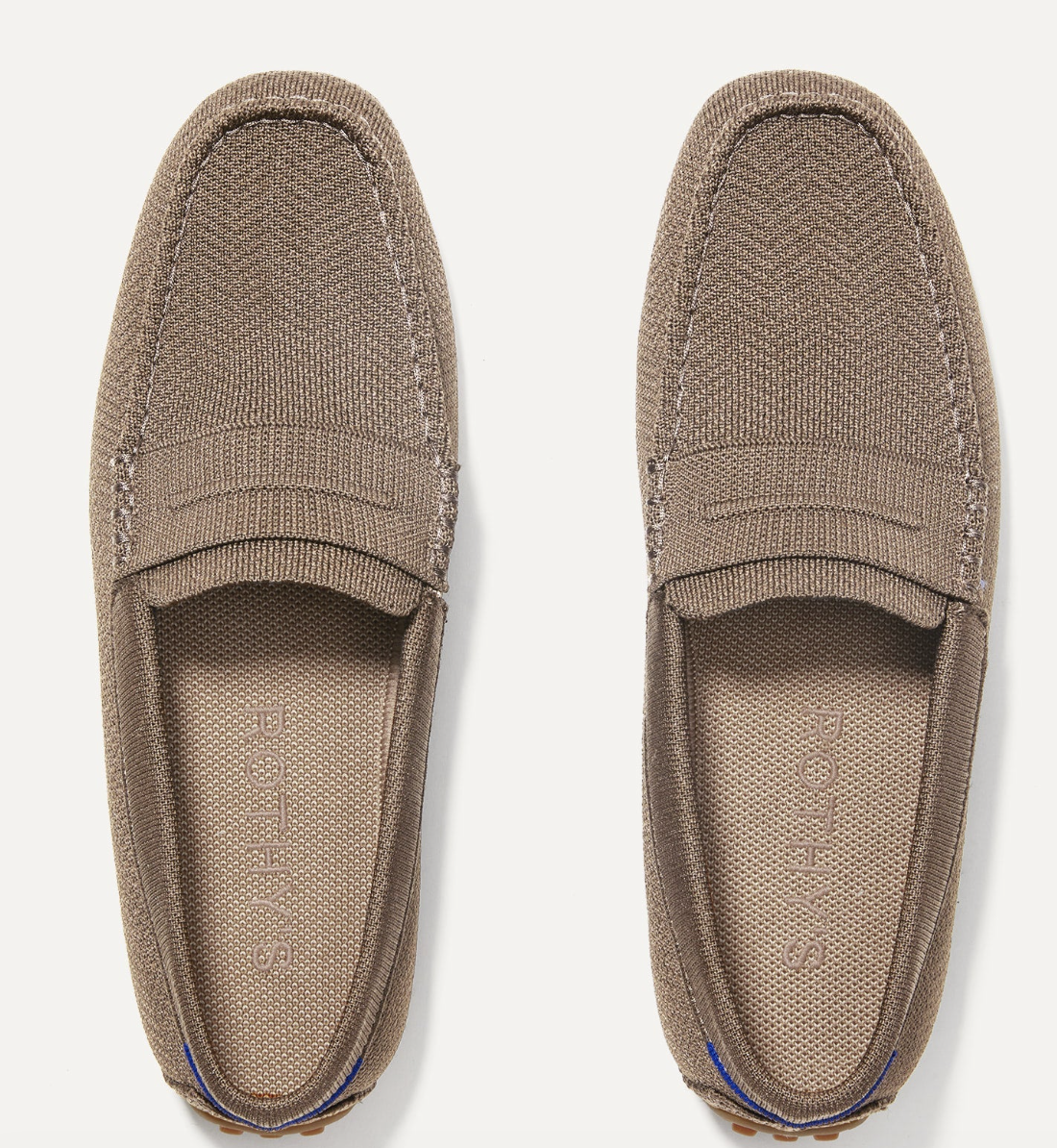 A pair of tan Rothy’s Driving Loafers with a nubby rubber sole, a comfortable and sustainable shoe option to pair with white straight-leg jeans.
