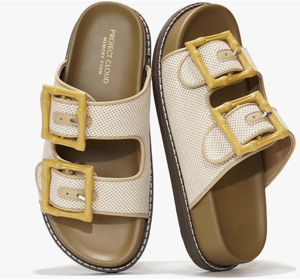 A pair of beige adjustable double strap summer slide sandals with yellow buckles and a memory foam footbed, perfect for a casual summer BBQ outfit.