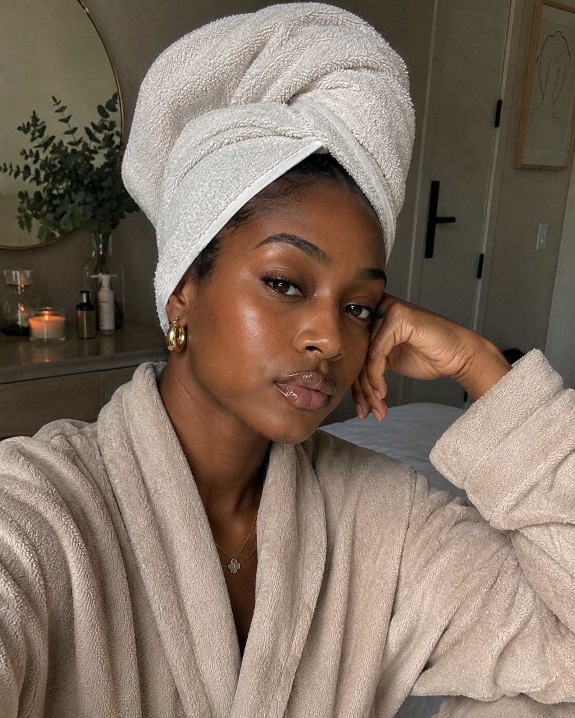 Woman with healthy hydrated curls after using a deep conditioner for summer-damaged hair
