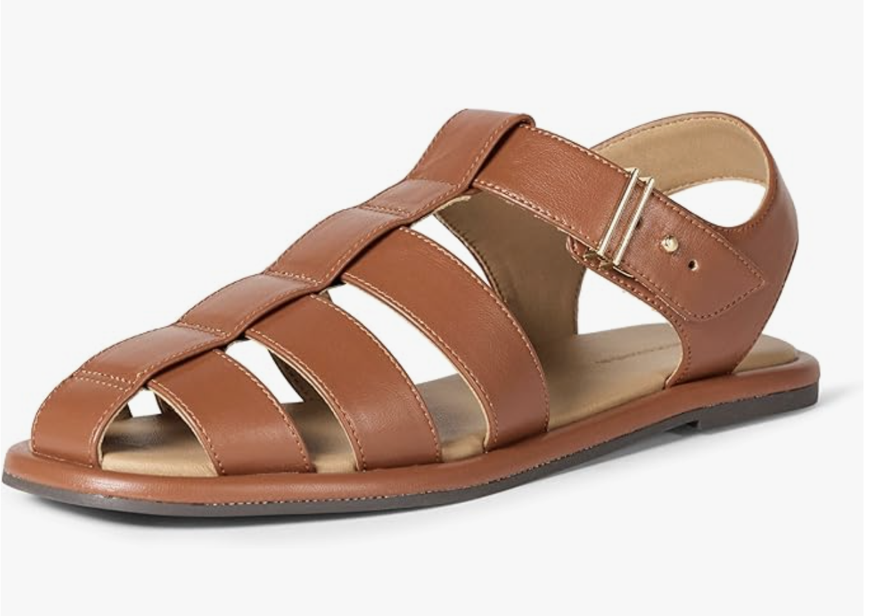 Close-up of the Amazon Essentials Closed Toe Fisherman Sandals in cognac brown faux leather featuring wide strappy cages and an adjustable ankle strap with a silver buckle.
