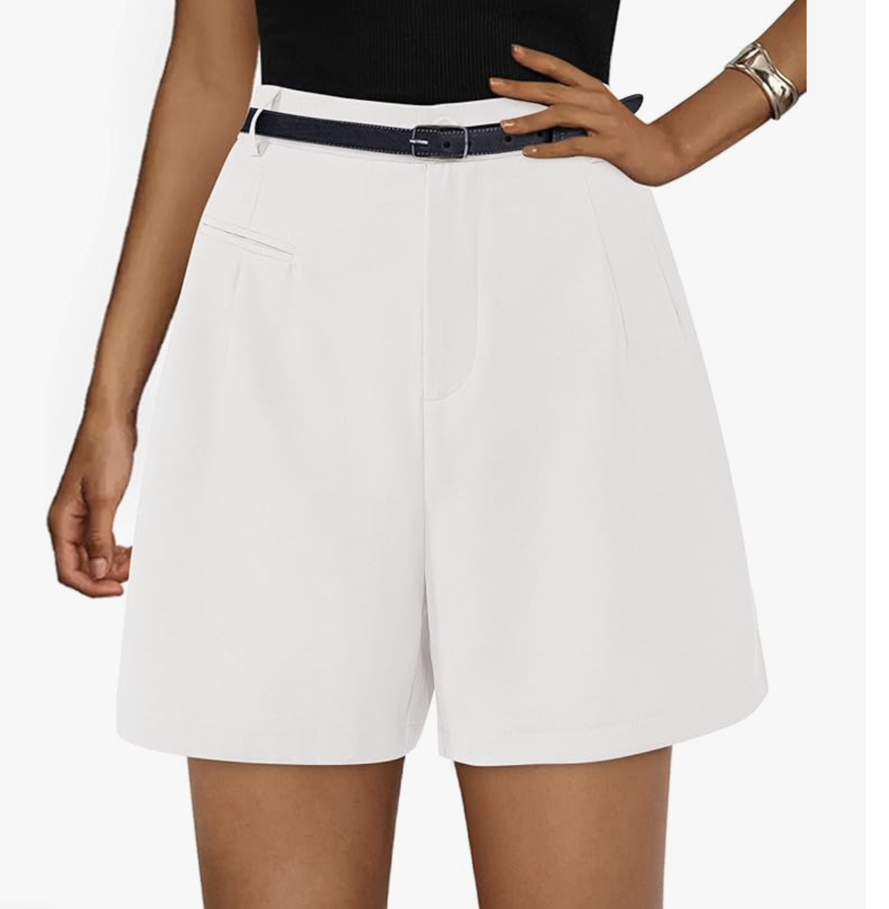 Woman wearing white high-waisted tailored work shorts with a black belt, featuring structured pleats and a mid-thigh length.