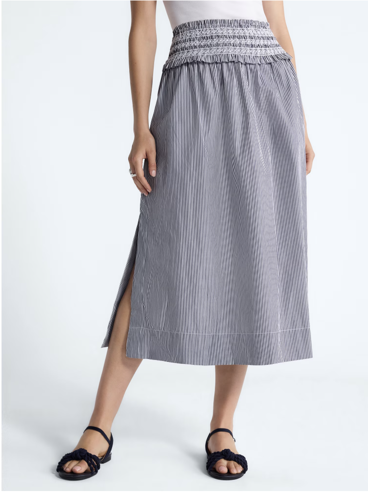 A long striped cotton maxi skirt featuring a classic vertical pattern.