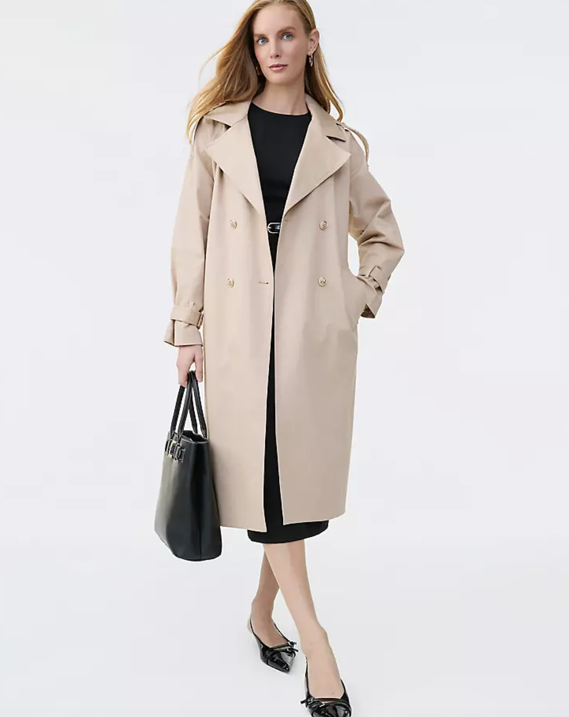Professional stylist's pick: a classic Ann Taylor Refined Trench Coat in a neutral tan, featuring a double-breasted front, belted waist, and a structured silhouette for ageless spring styling.