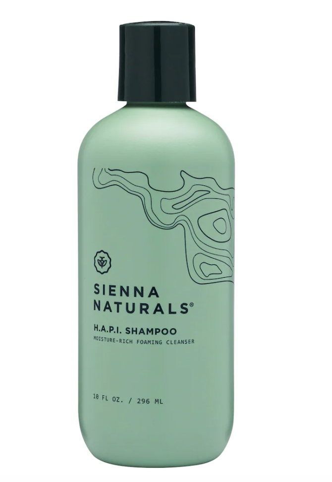 Sienna Naturals Hydrating H.A.P.I. Shampoo in a sage green bottle, a moisture-rich foaming cleanser designed to clean curls and coils without stripping natural oils.