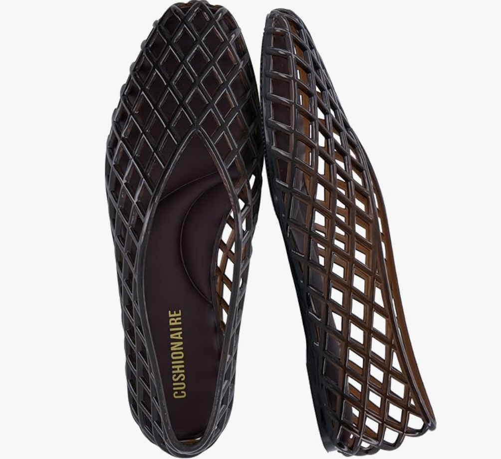 A close-up of a pair of dark brown or tortoise shell woven cage-style jelly ballet flats by Cushionaire.