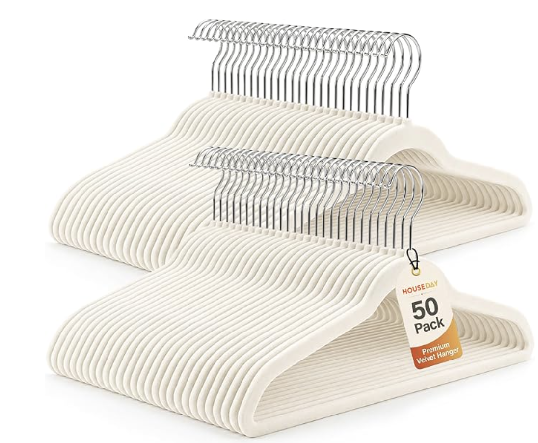 Ivory velvet nonslip hangers arranged in a closet