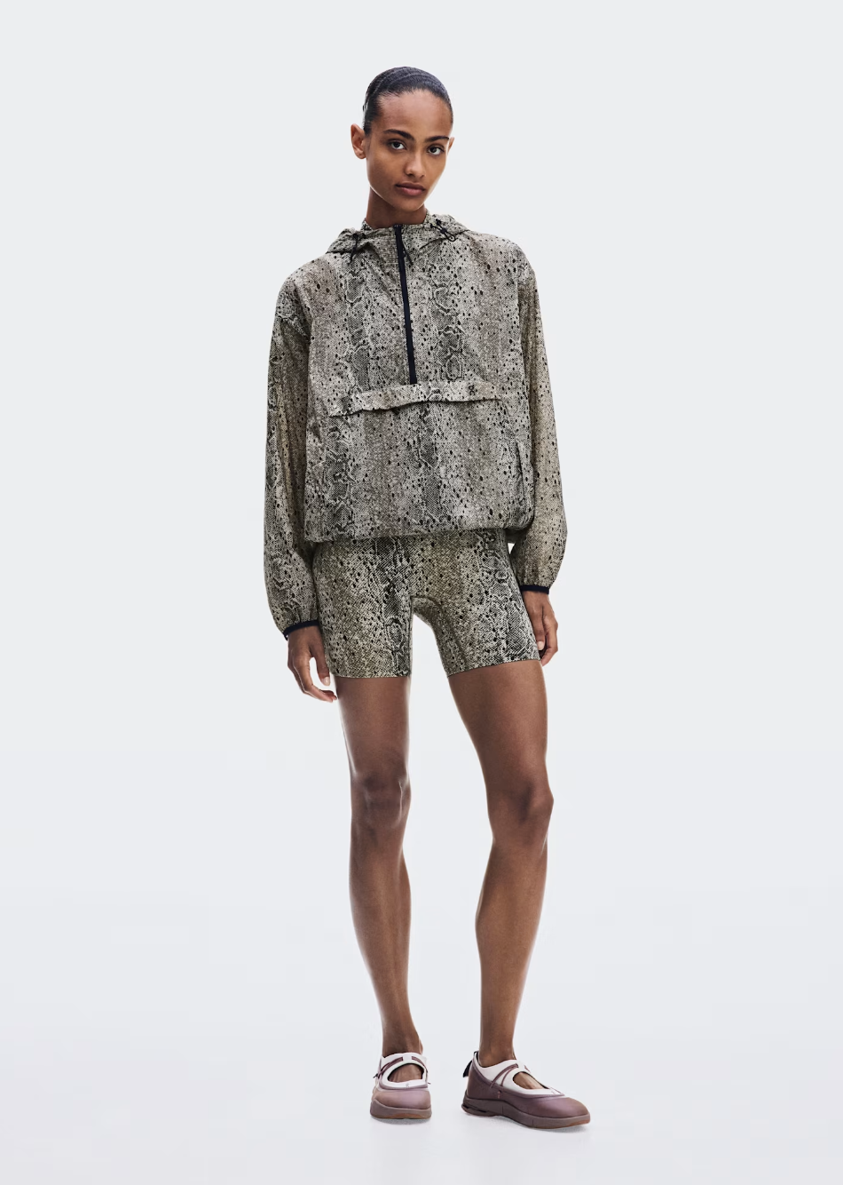 Python-print On Half-Zip Anorak in Antler and Black with an adjustable hood and bungee-cord hem.