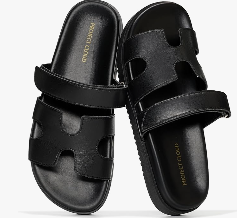 A pair of black genuine leather H-band slide sandals with a comfortable footbed, perfect for a casual summer BBQ outfit.