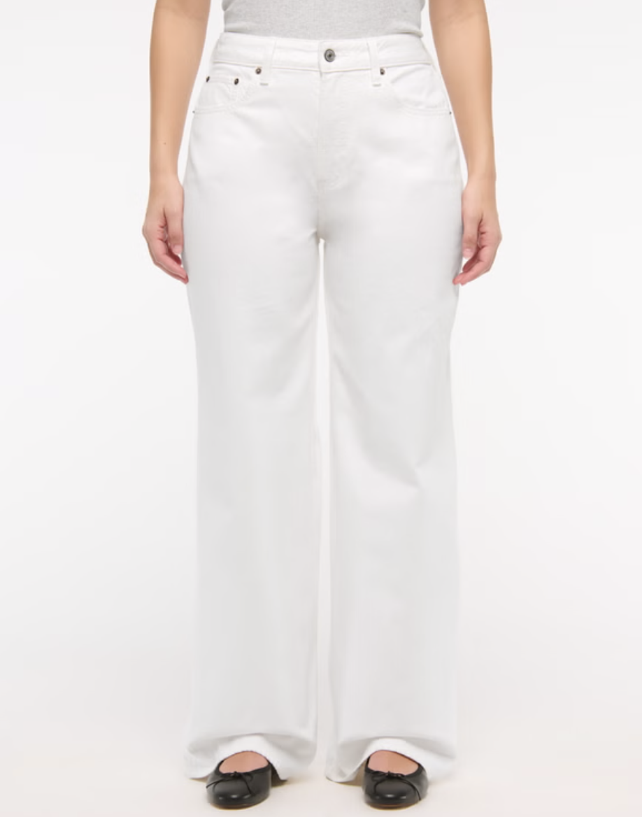 Woman wearing Abercrombie Curve Love high-rise wide-leg jeans with a fitted waist and full-length leg.