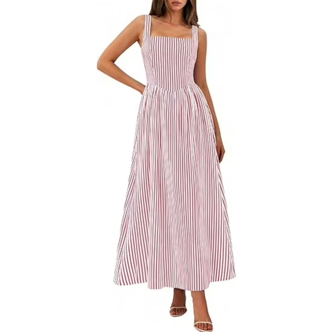 A woman wearing a sleeveless maxi dress with vertical red and white stripes, featuring a structured square neckline and a flowy A-line silhouette.