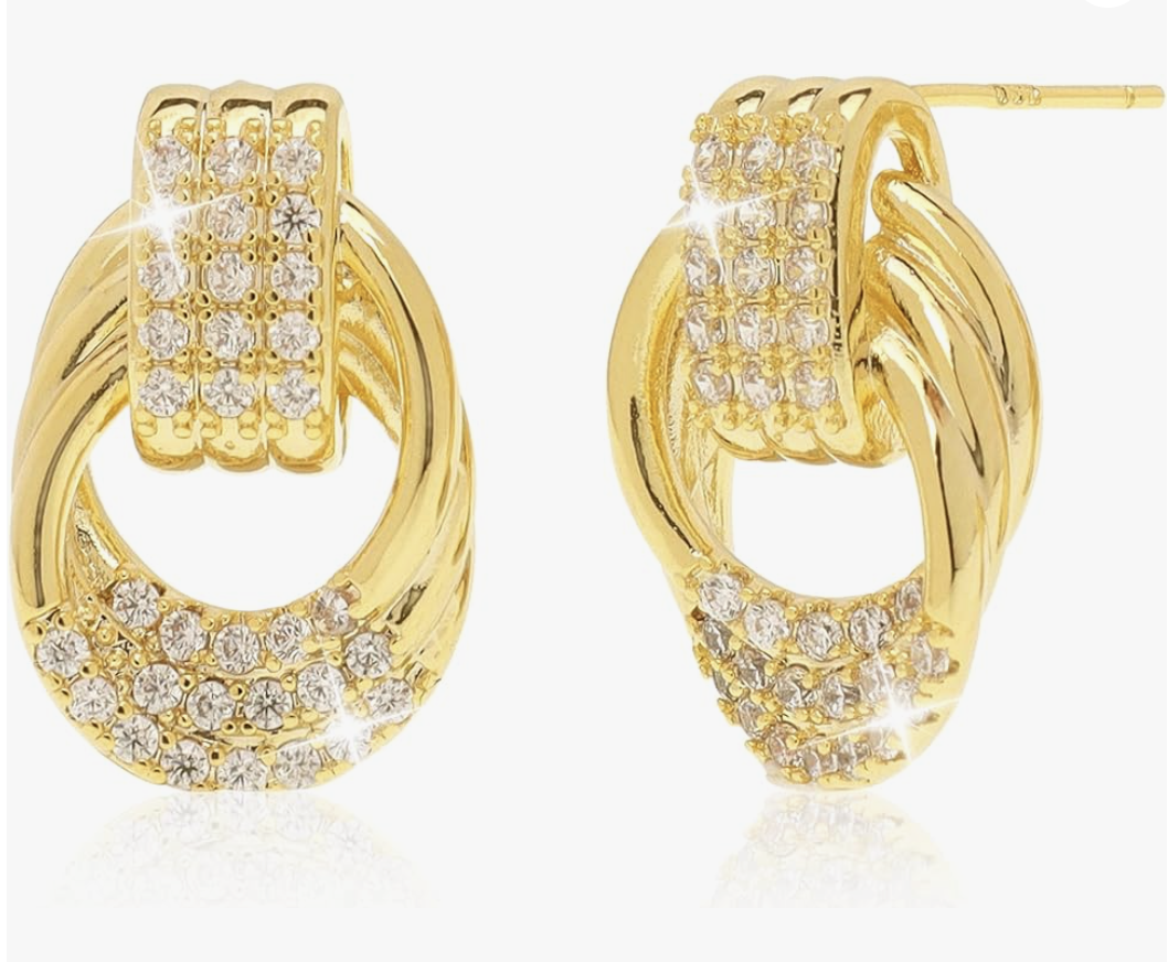 A pair of chunky gold-toned stud earrings with a knotted design and pavé cubic zirconia accents, styled for a summer BBQ outfit.