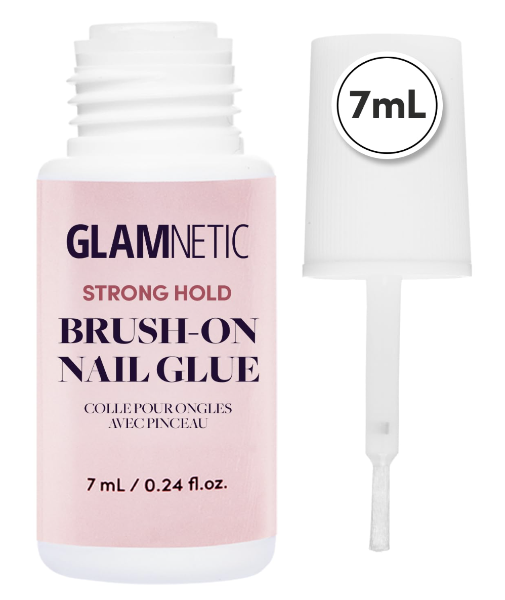 Pink bottle of Glamnetic Strong Hold Brush-On Nail Glue next to its brush applicator cap.