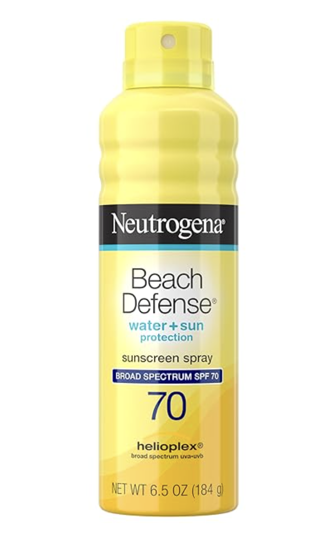 A close-up of a yellow bottle of Neutrogena Beach Defense water-resistant sunscreen spray SPF 70.