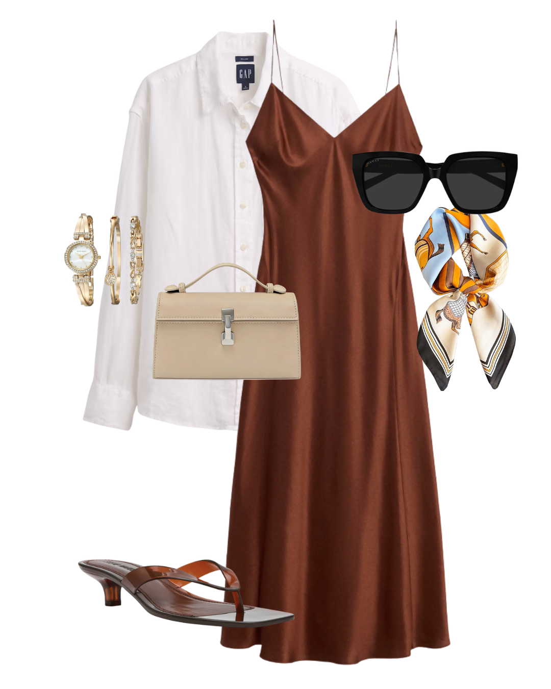 Flat lay of an evening Paris outfit featuring a brown silk slip dress, a white button-down shirt, brown kitten heel sandals, a beige handbag, and a gold watch.