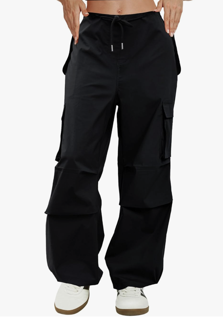 A pair of black high-waisted parachute cargo pants with an oversized wide-leg fit, side utility pockets, and adjustable drawstring ties at the ankles.