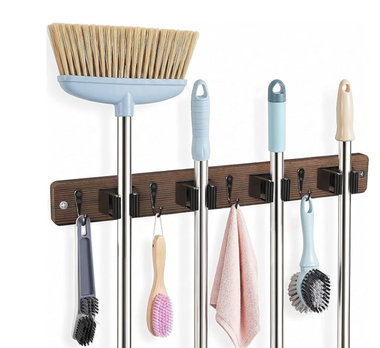 Wall-mounted holder storing brooms and cleaning tools vertically