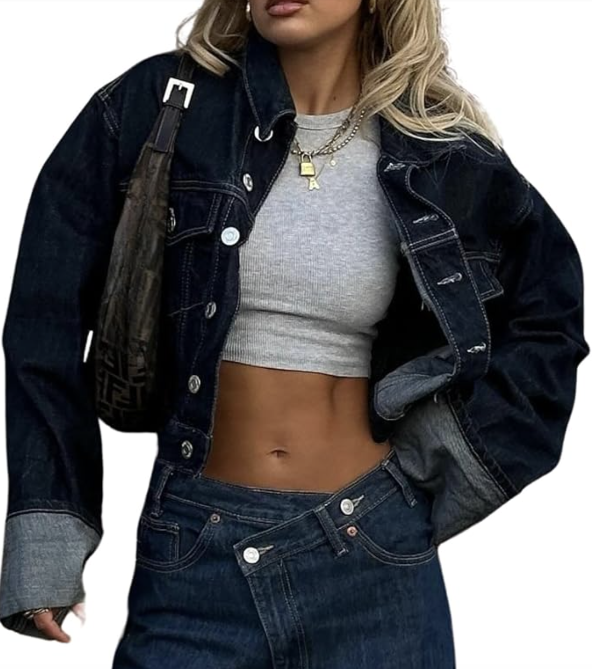 Cropped grey top paired with a dark wash denim jacket, layered gold necklaces, and low-rise blue jeans for a casual summer outfit.