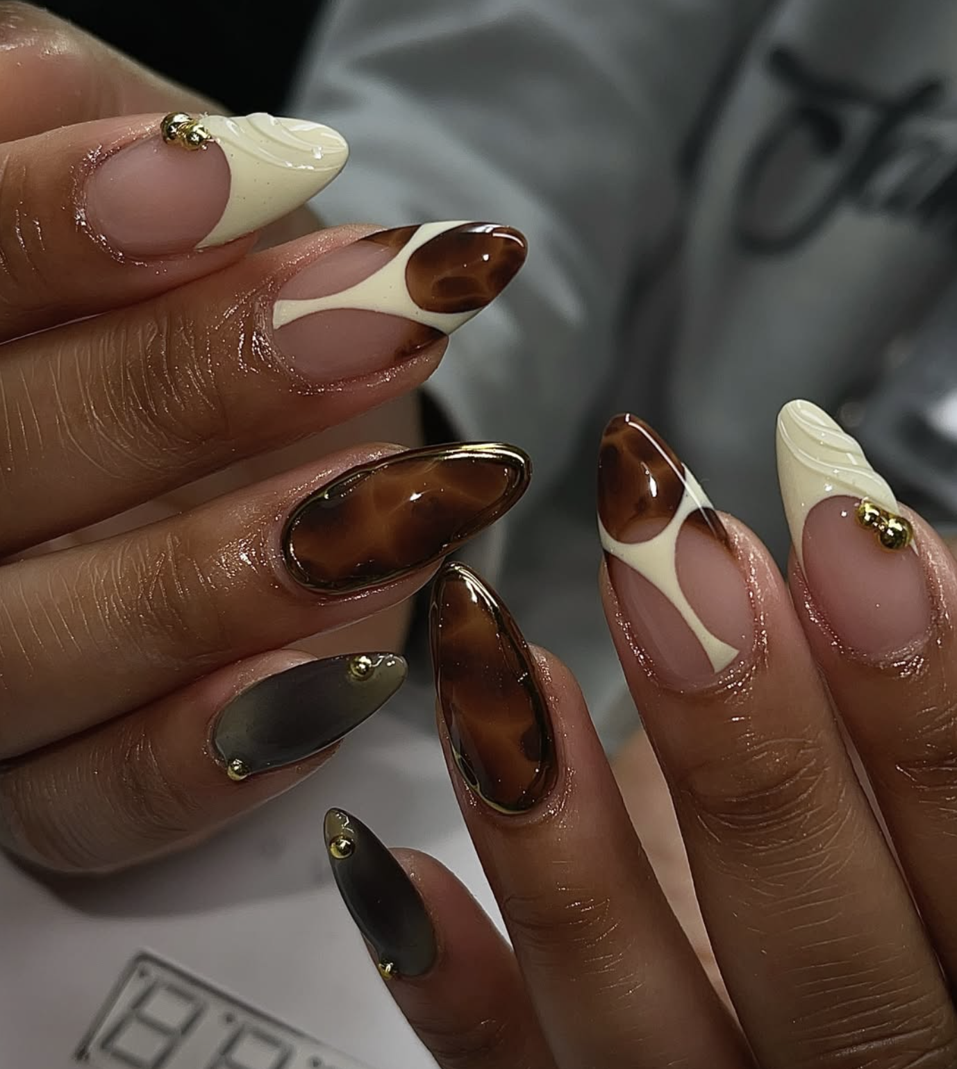 Amber and chocolate brown tortoiseshell Thanksgiving nail design