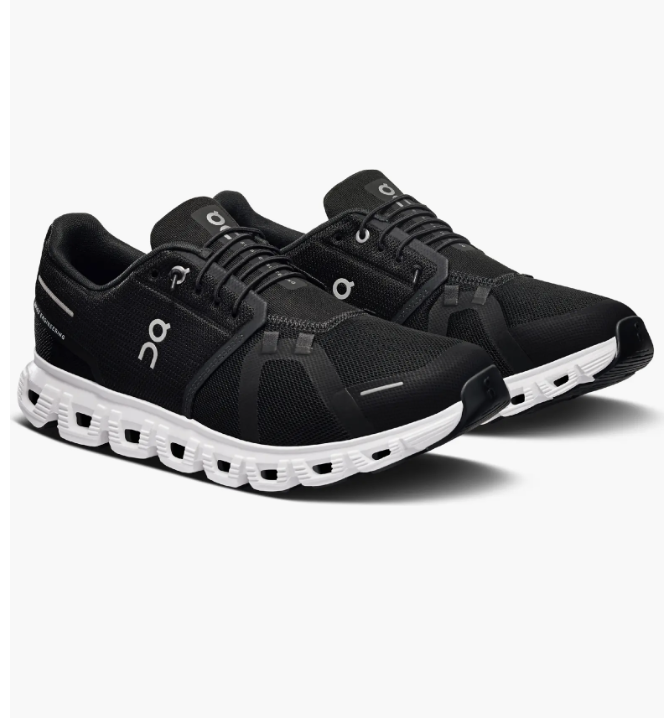 A side profile shot of all-black On Cloud 6 sneakers, showcasing the signature white CloudTec cushioned sole.