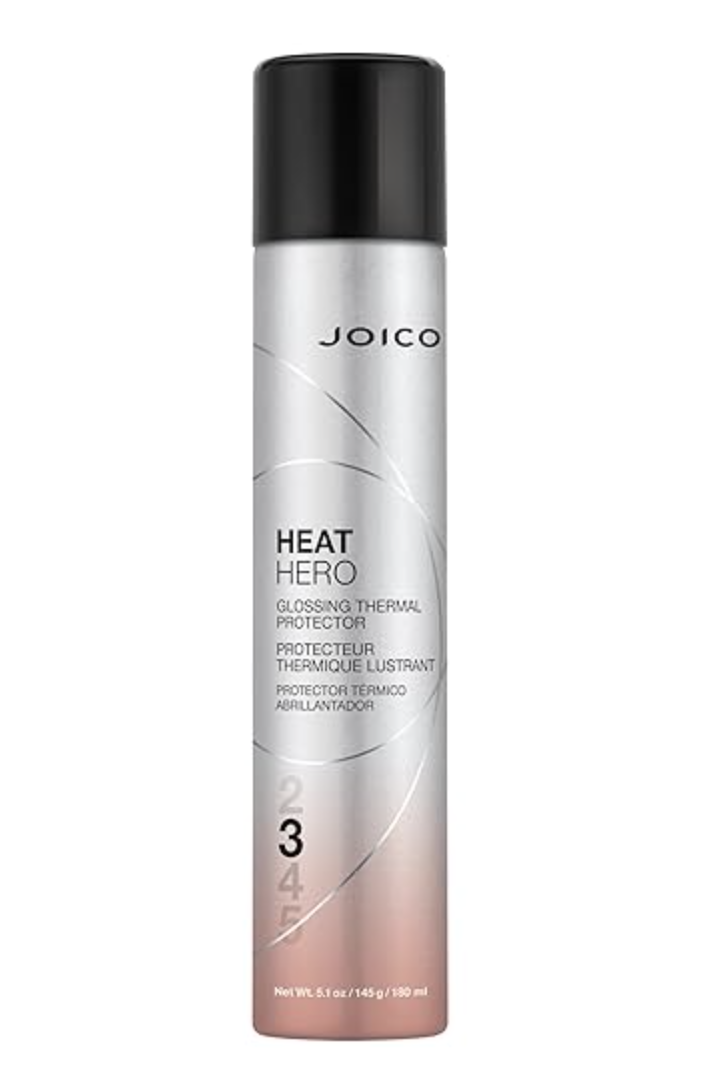 A silver and black aerosol bottle of Joico Heat Hero Glossing Thermal Protector spray, shown against a clean background.