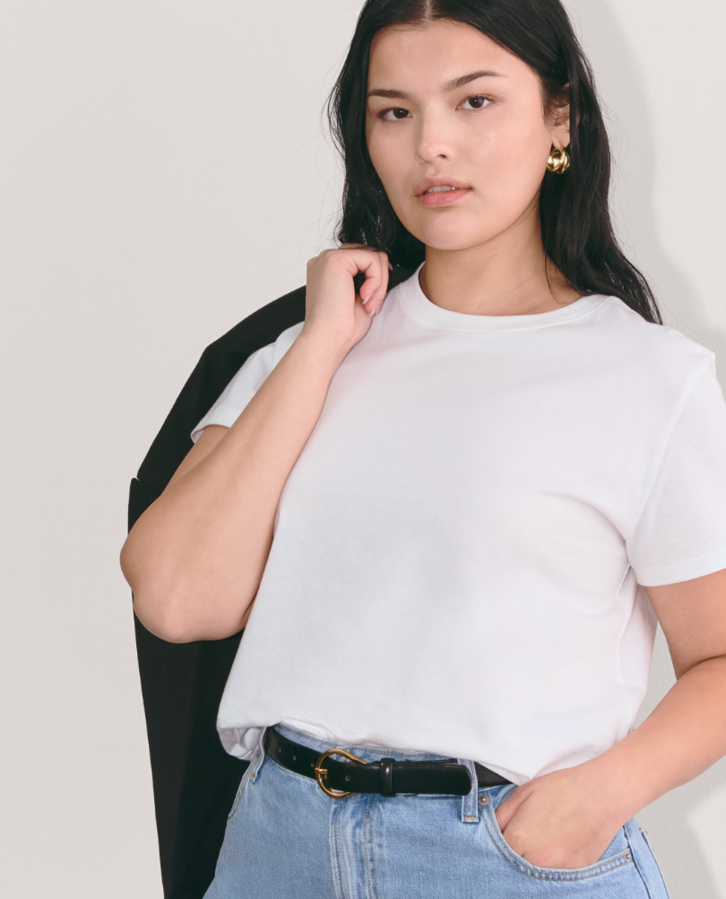 Woman wearing the Everlane Box-Cut Tee in white, a thick and sustainable cotton t-shirt that isn't see-through.
