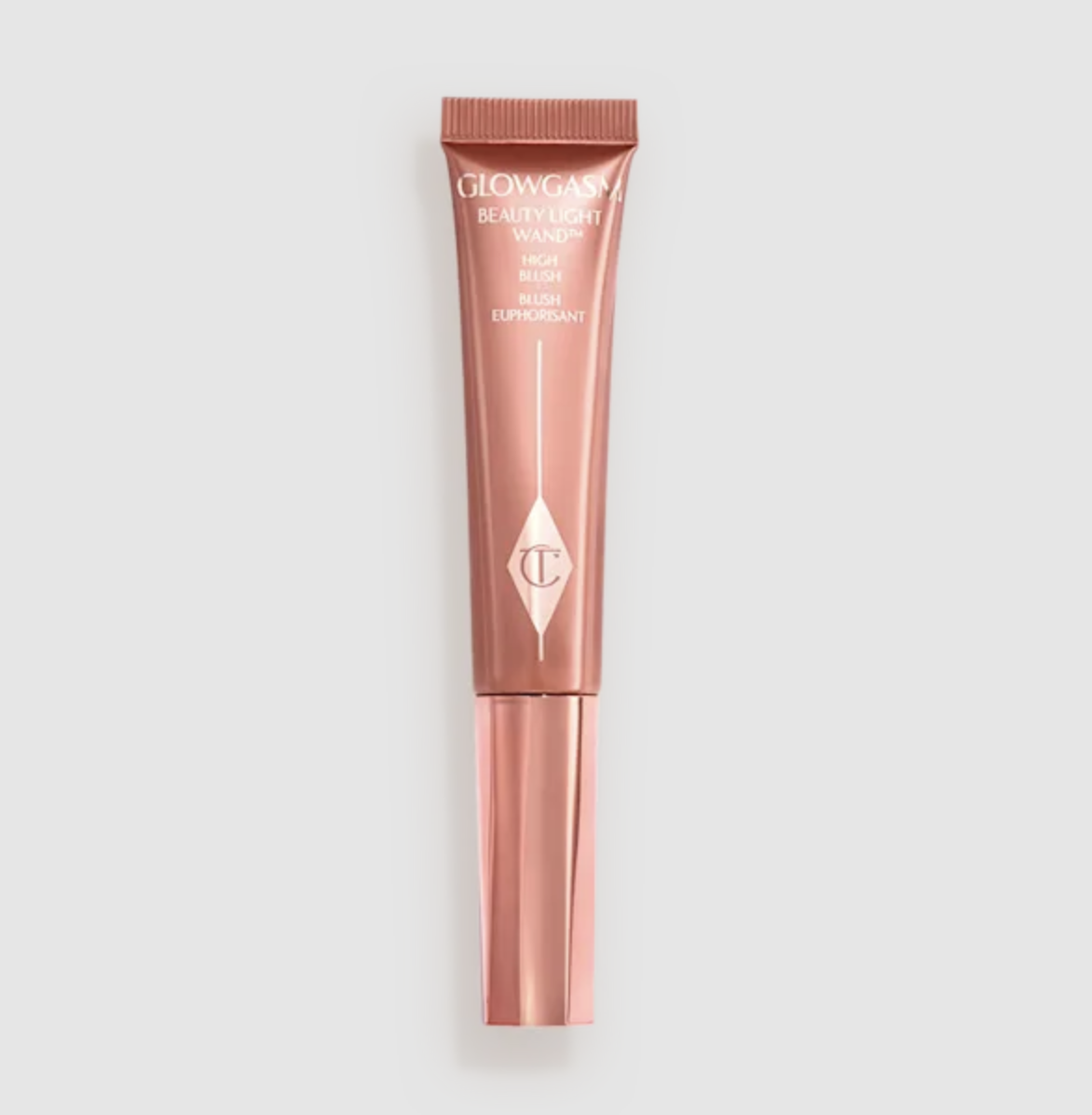 A close-up of the Charlotte Tilbury Glowgasm Beauty Wand applicator tip with a drop of product.