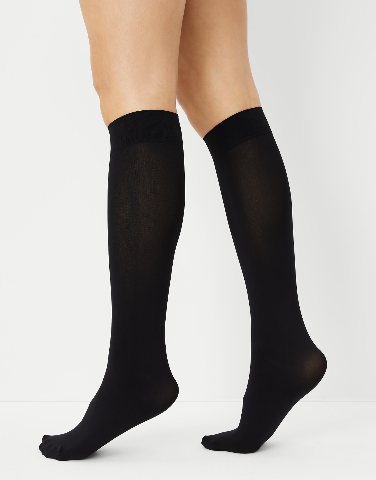 Pair of Ann Taylor sheer knee-high hosiery in black