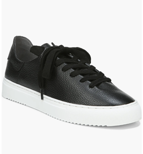A pair of black leather Sam Edelman Poppy sneakers with a white platform sole, styled as professional work sneakers for a business casual office.