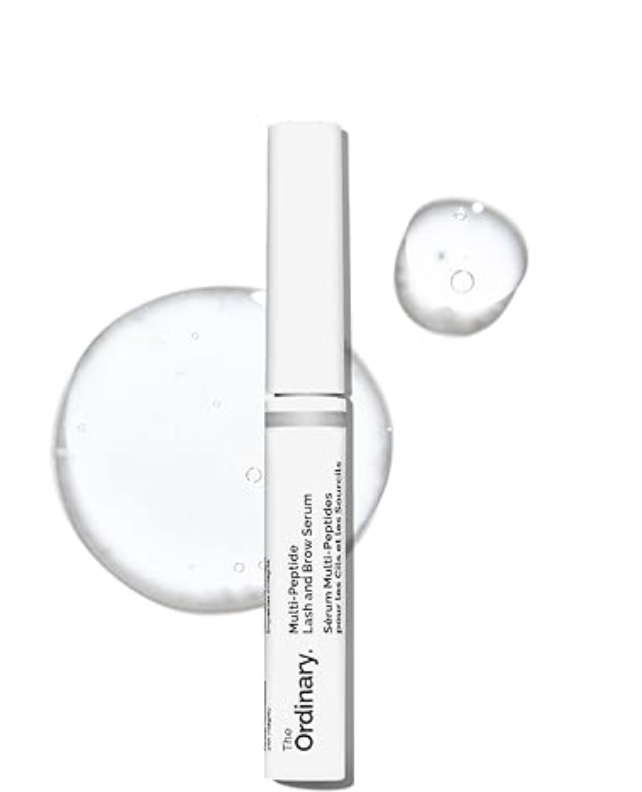 "A sleek white tube of The Ordinary Multi-Peptide Lash and Brow Serum shown with its fine-tip brush applicator and a clear droplet of the peptide-powered formula."