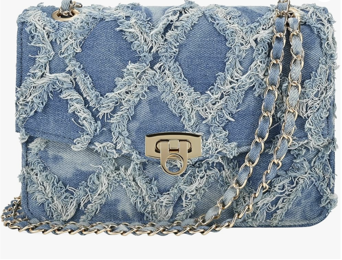 A light blue quilted denim shoulder bag with distressed frayed edges, a gold twist-lock clasp, and a gold chain-link strap.