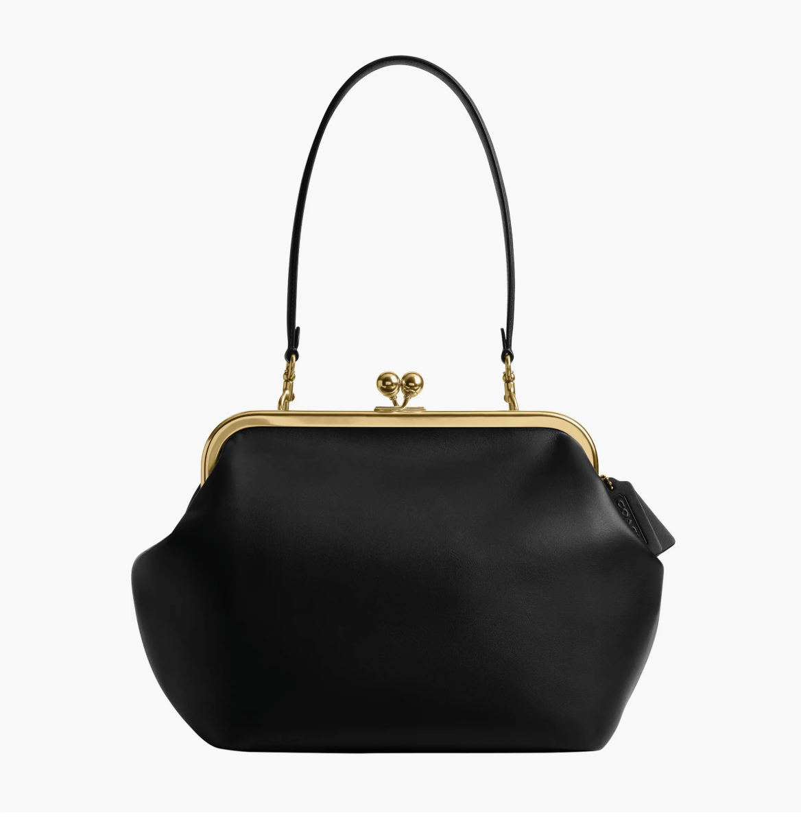 : Vintage-style kiss-lock purse with a metal clasp styled with a blazer, dark jeans and flats.