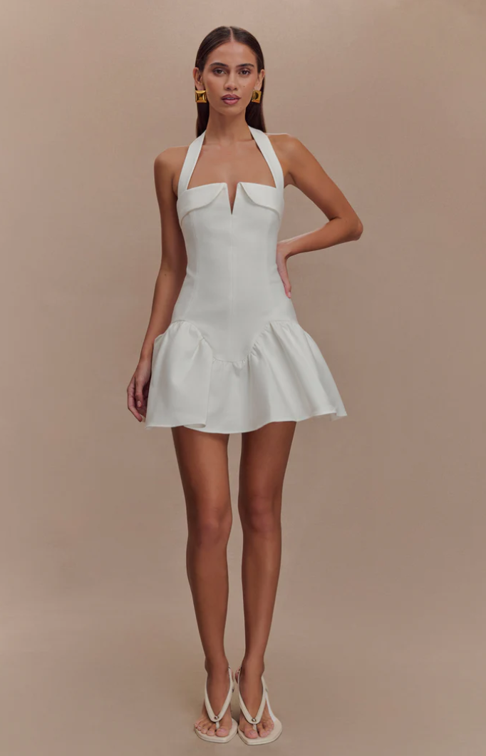 woman wearing. aHalter Mini Dress
