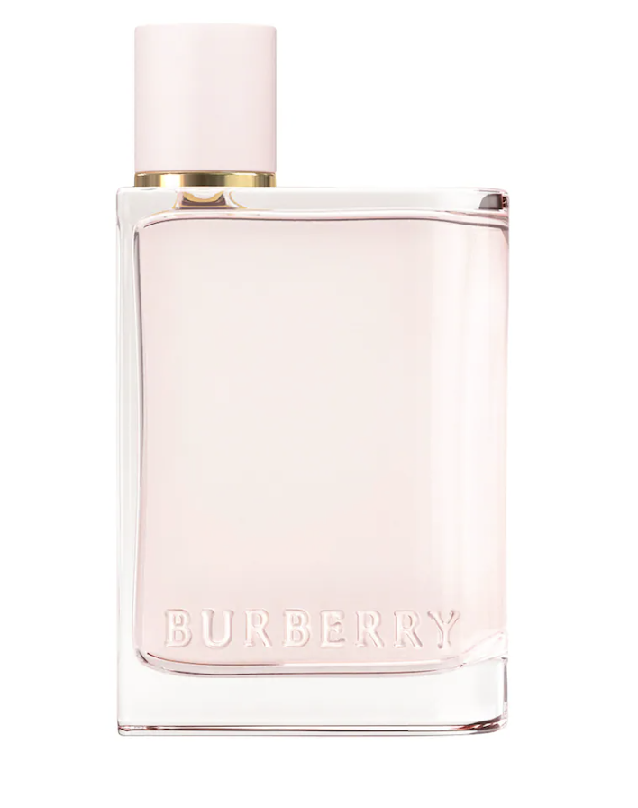 A sleek, minimalist glass bottle of Burberry Her Eau de Parfum with a light pink liquid and an off-center white cap, showing the embossed Burberry logo on the glass.