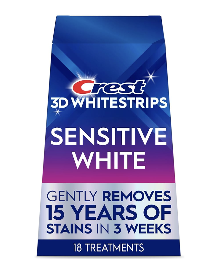 Box of Crest 3D Whitestrips Sensitive White teeth whitening treatments, featuring the "Gently Removes 15 Years of Stains in 3 Weeks" label.